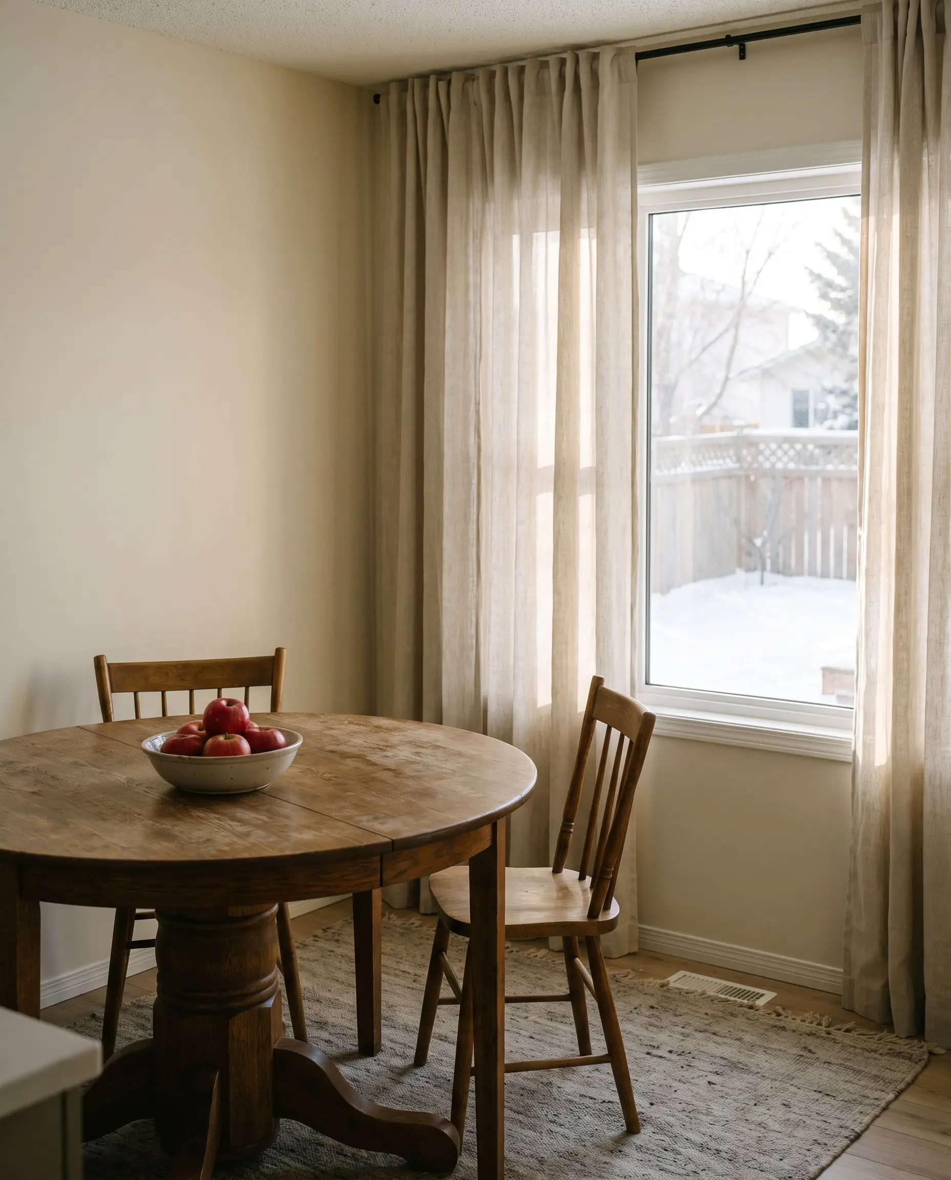 A sunlit kitchen with an oak table, Regina